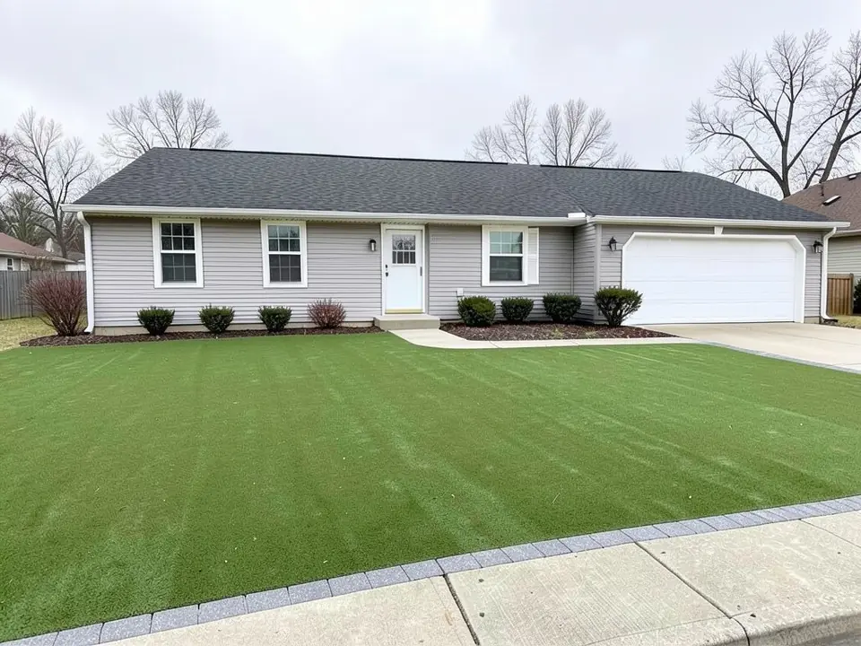AI-edited version of the same image: the front lawn replaced with even green artificial turf and a row of gray pavers along the sidewalk