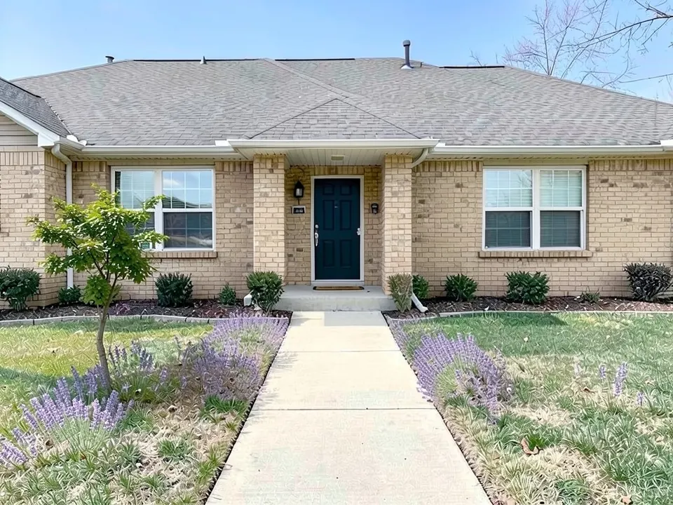 AI-edited version of the same image: loose clumps of purple lavender in the lawn along both sides of the concrete walkway, thicker on the left, and a small leafy tree in the left lawn in front of the left window